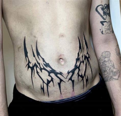 tatuaje en el abdomen|tatuajes de flores en el abdomen.